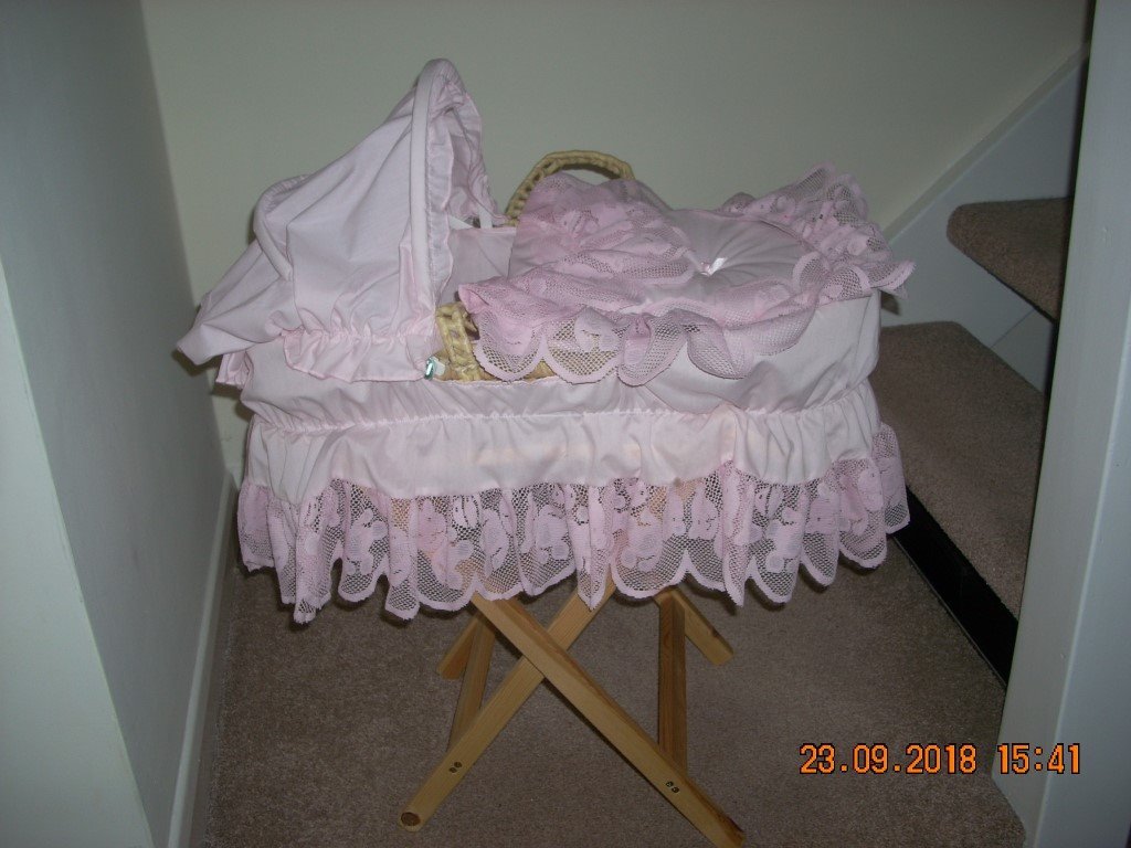 pink dolls moses basket with stand